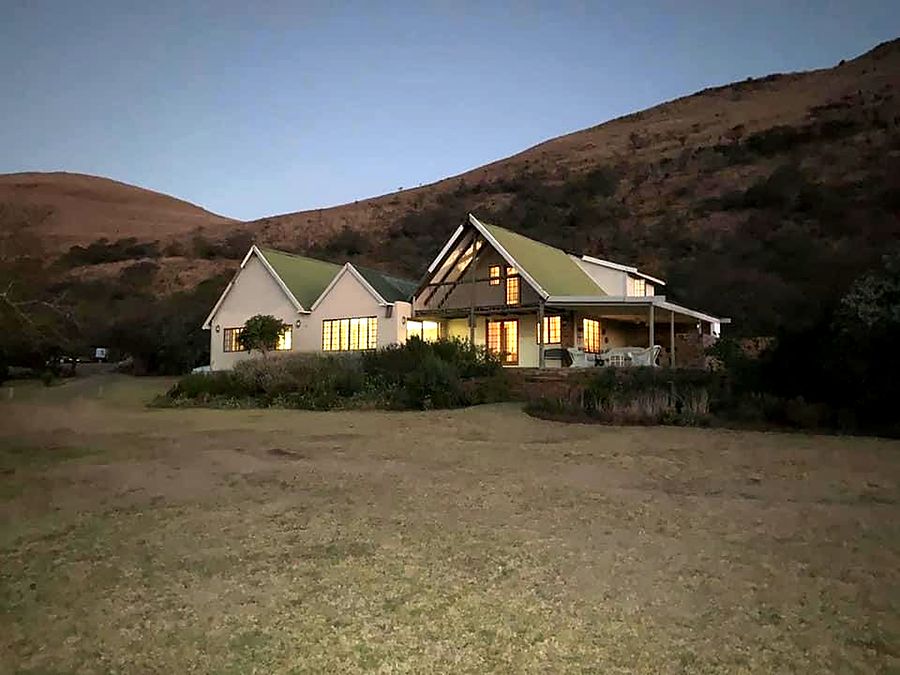 The Main House at dusk with the lights on